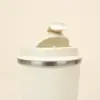 Taza térmica con tapa abierta fondo beige
