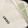 Funda portátil 15 pulgadas personalizada logo negro cuaderno verde lapicero blanco