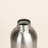 Botella acero inoxidable personalizada abierta color plateado fondo beige