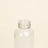 Botella de cristal personalizada sin tapon fondo beige