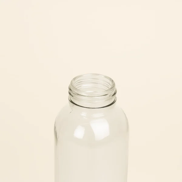 Botella de cristal personalizada sin tapon fondo beige
