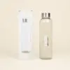 Botella de cristal personalizada con caja fondo beige