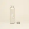 Botella de cristal personalizada abierta con tapón fondo beige