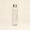 Botella de cristal personalizada logo frontal fondo beige