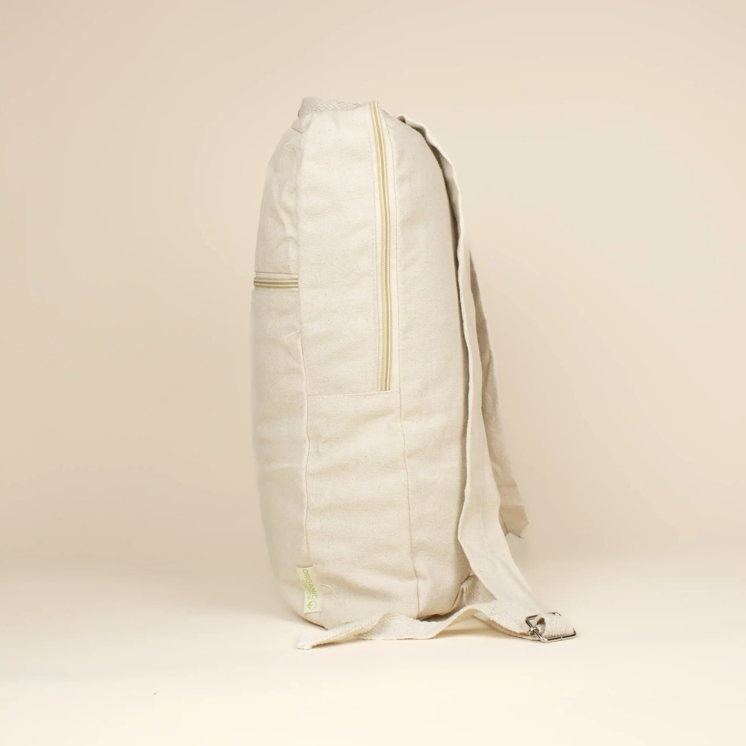 Mochila de algodón personalizada FLUFFY Lateral Mochila de algodón personalizada beige lateral fondo beige