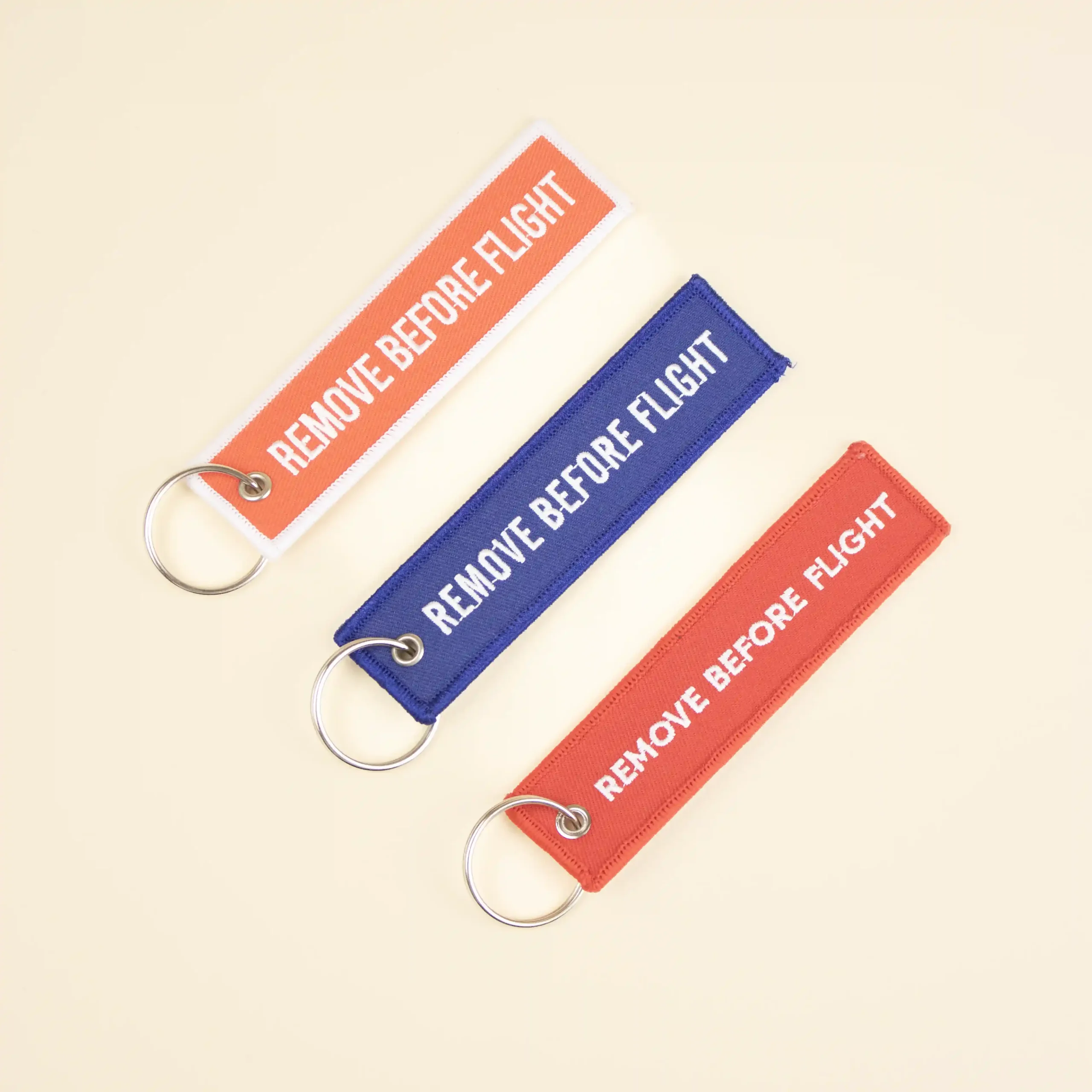 Llaveros de tela bordados FILOS Llaveros de tela personalizados bordados con hilo blanco