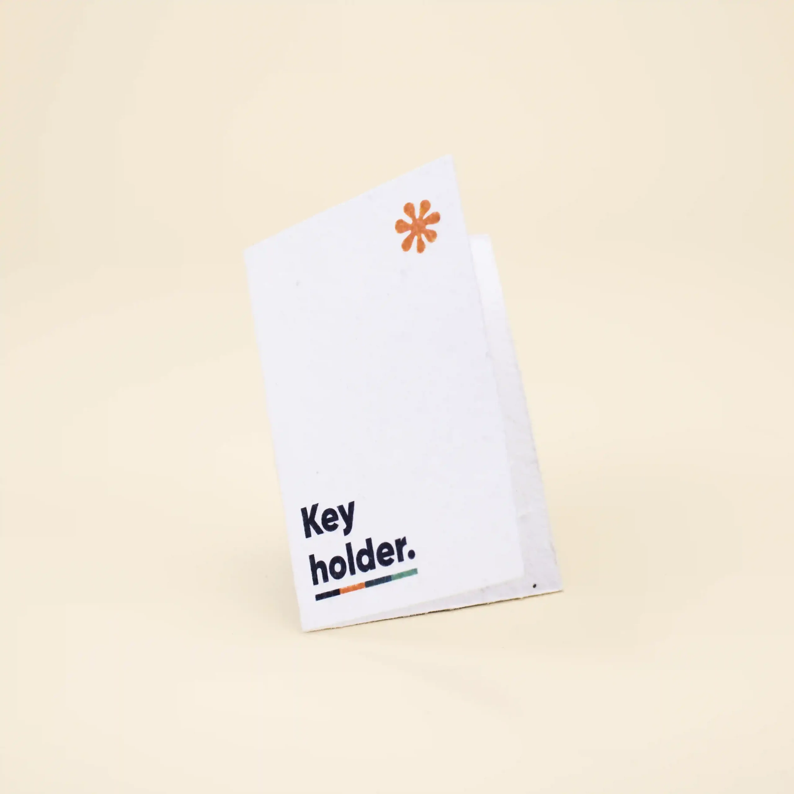 Porta llaves de hotel en papel plantable blanco personalizado con la palabra key holder en azul