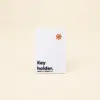 Porta llaves de hotel en papel ecológico blanco personalizado con la palabra key holder en azul
