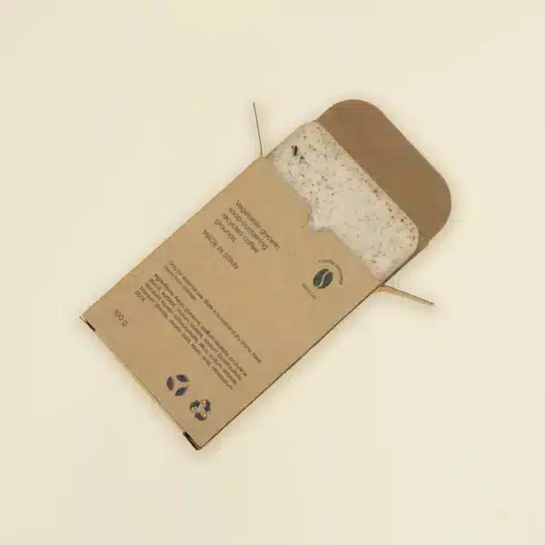Jabón artesanal dentro una caja marrón kraft personalizada abierta