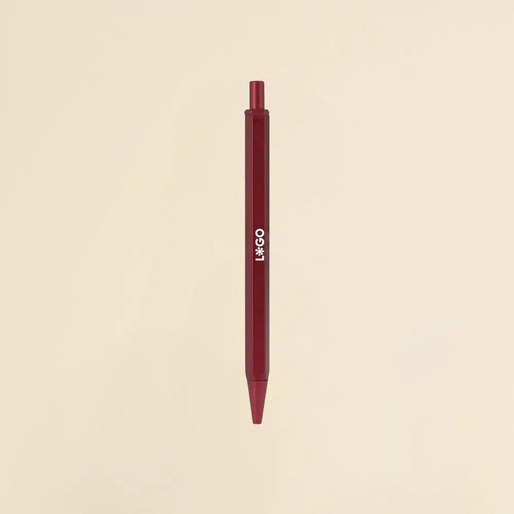 Bolígrafo de aluminio rojo sobre un fondo beige