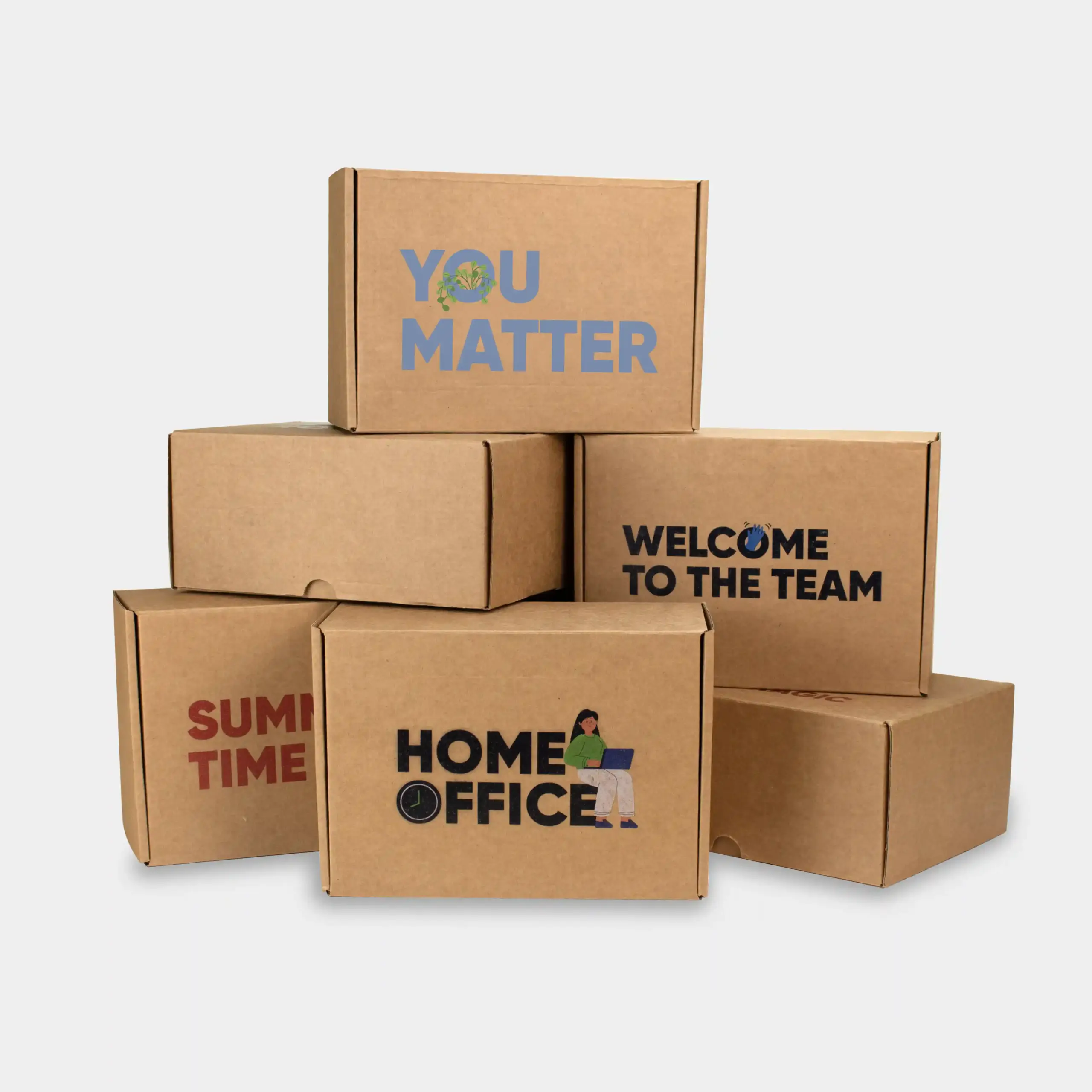 6 cajas de cartón apiladas y personalizadas como packs de regalos para empresas