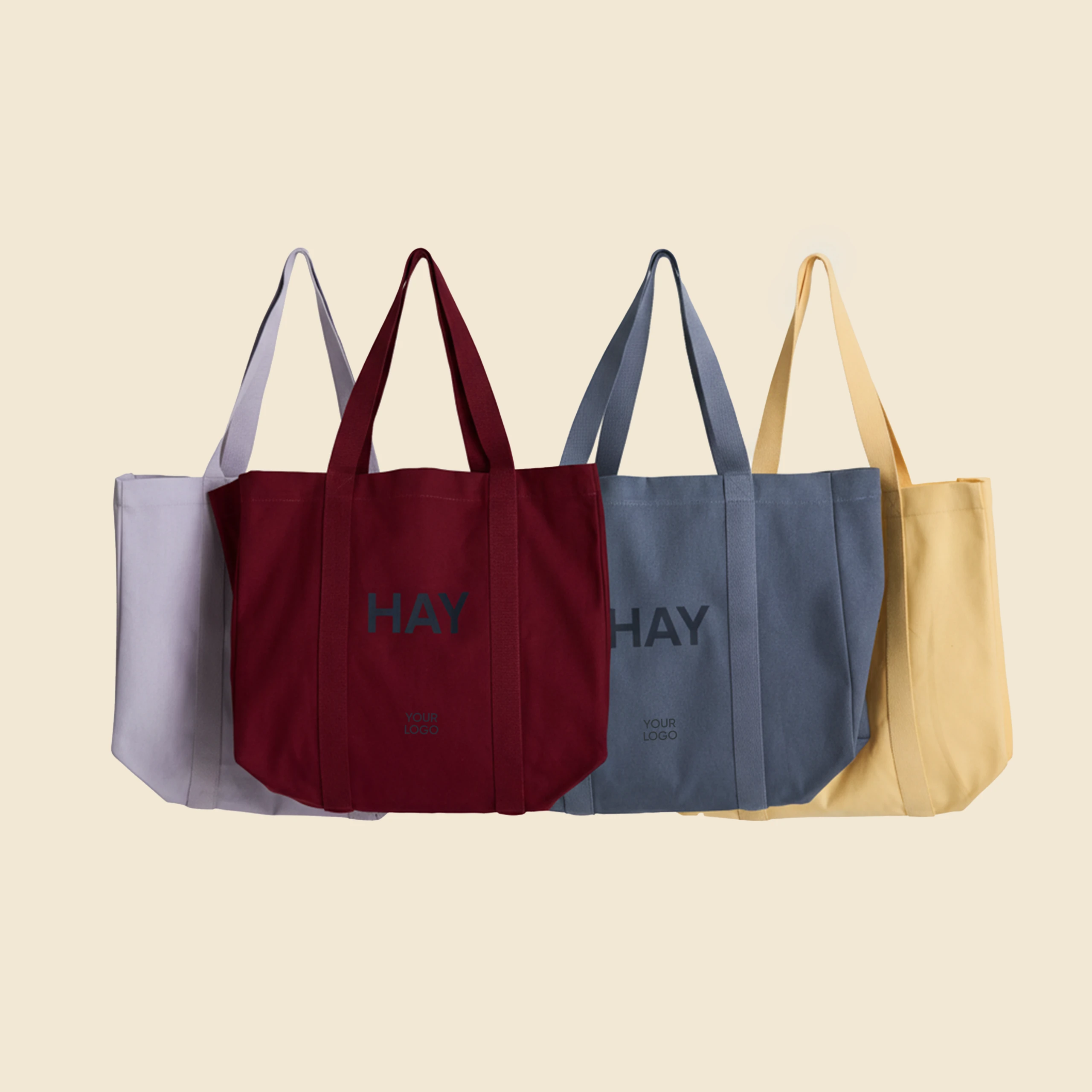 Bolsa de diseño de la marca HAY con impresión a todo color y a una tinta. De color amarillo, lila, rojo y azul.