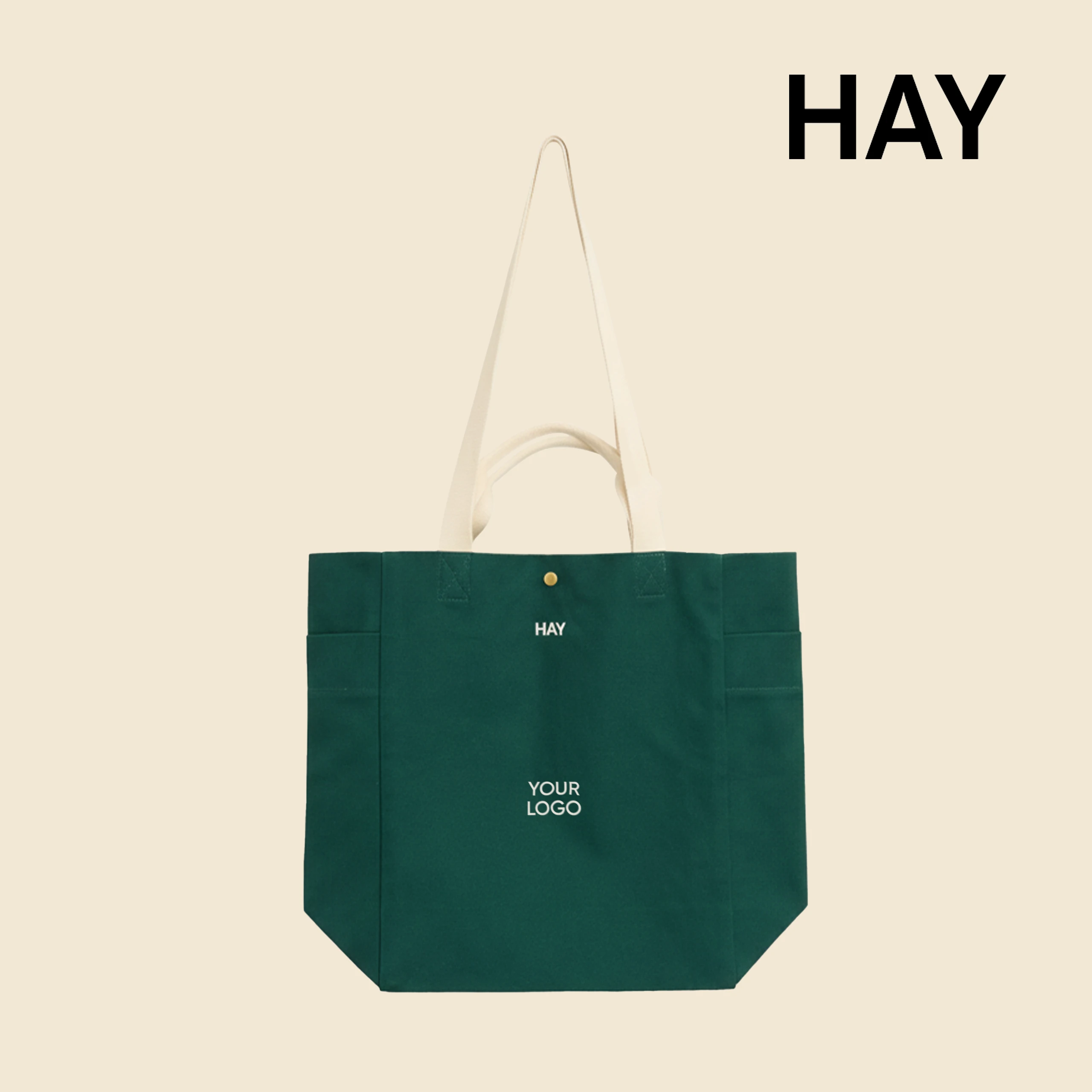 Bolsa tote de algodón orgánico de la marca HAY. Personalizable a todo color y a un color. De color verde y asas beige.