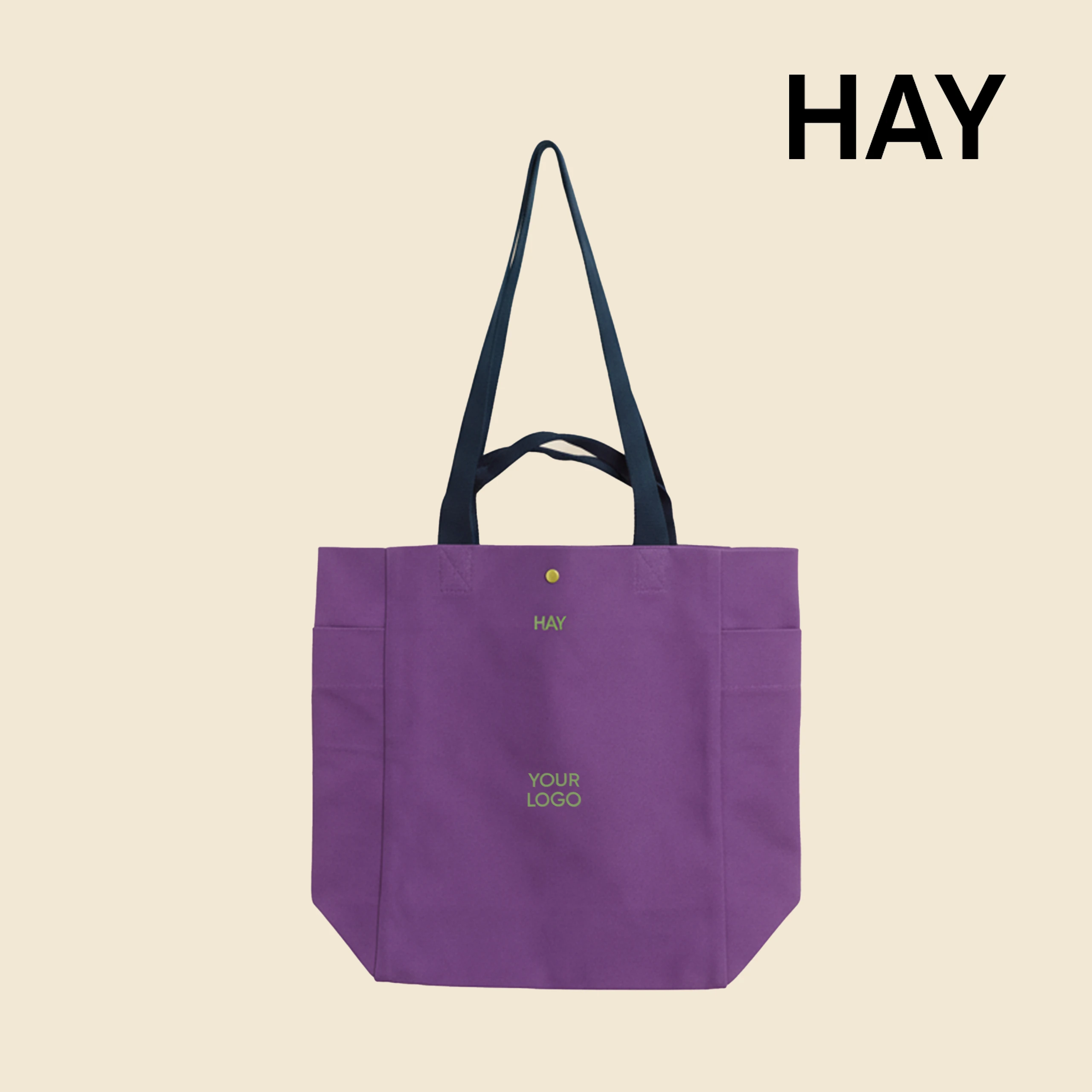 Bolsa tote de algodón orgánico de la marca HAY. Personalizable a todo color y a un color. De color morado y asas azul.