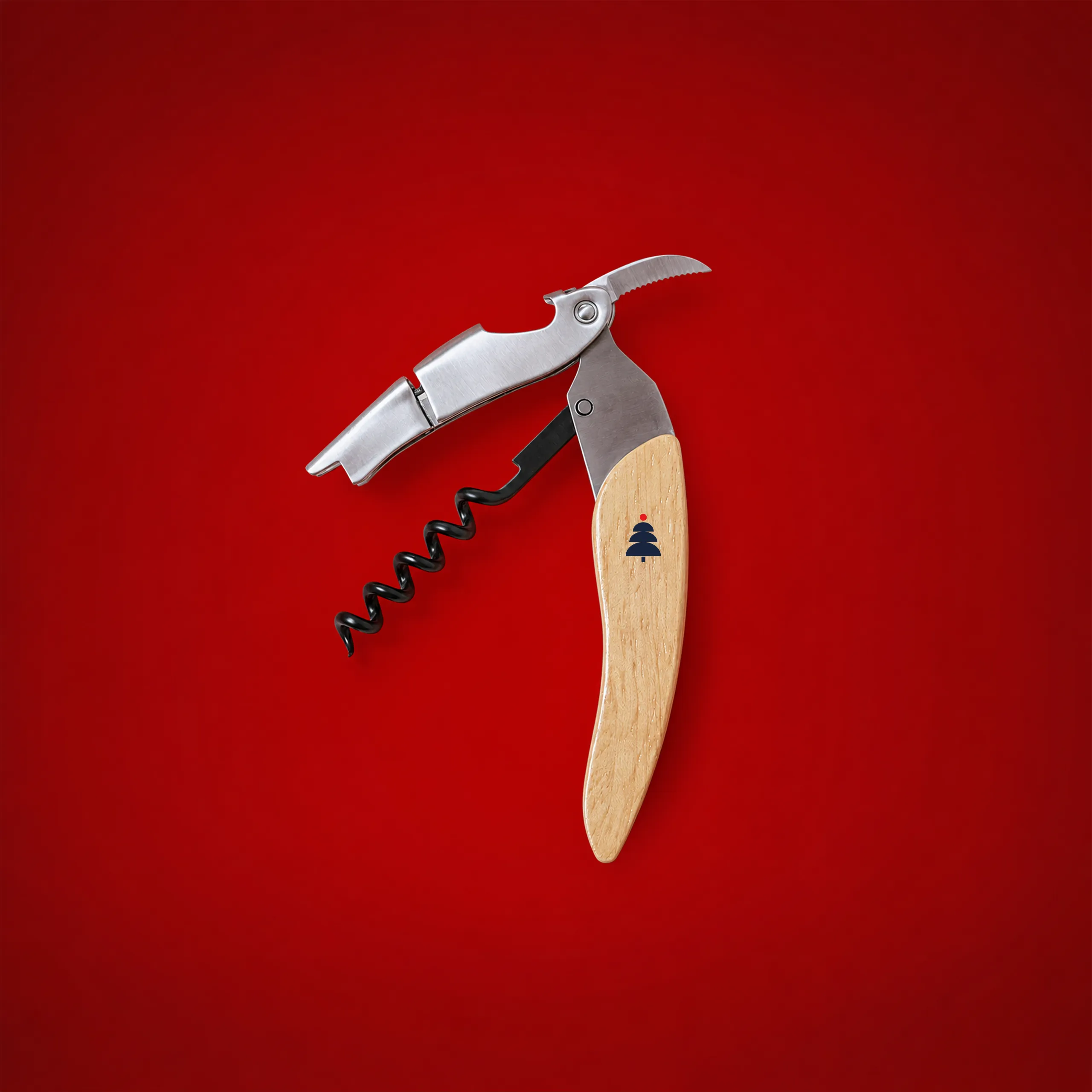 Personalised wooden corkscrew open on a festive red background, with a Christmas tree icon engraved on the handle.